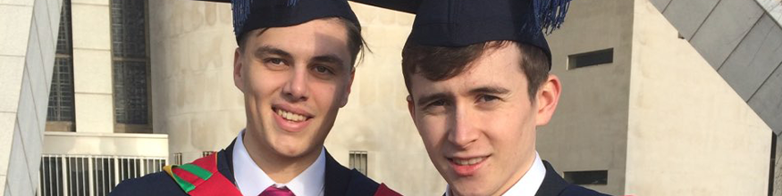 Best friends posing for a photo on their graduation day